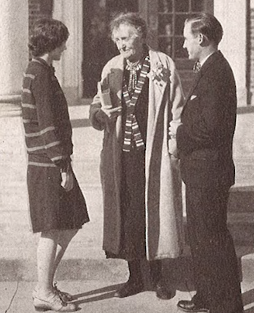 Estelle McMillan Blake with students in front of Cone-Bottoms Hall