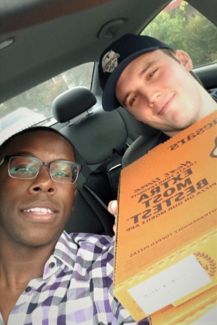 Aaron and Cedric with pizza for their students