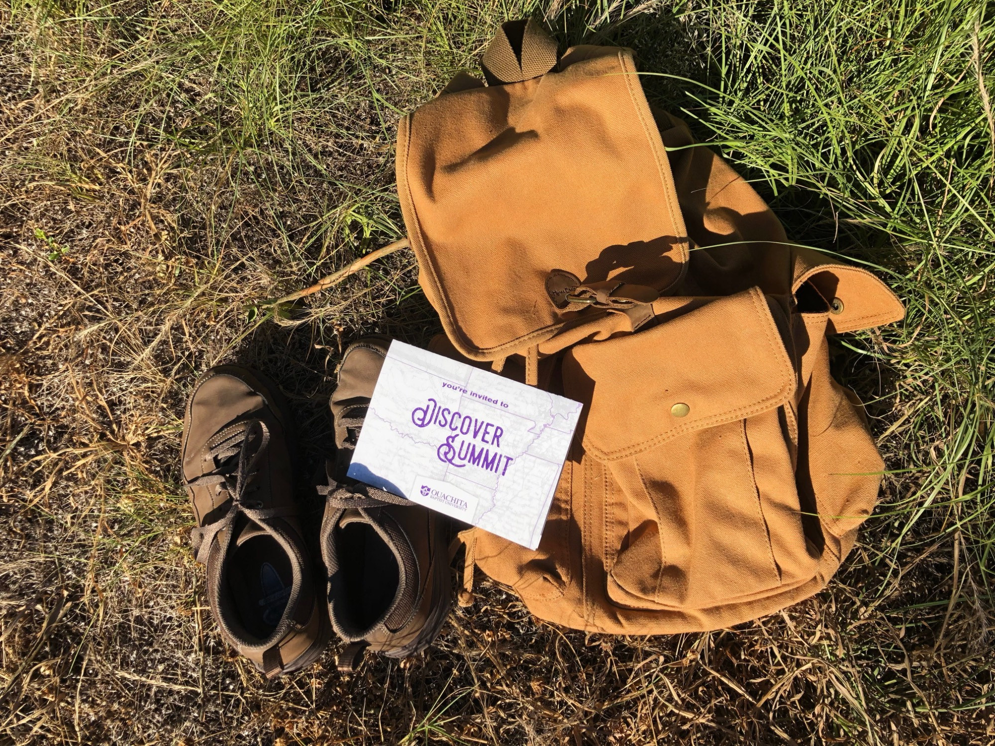 Discover Summit logo and backpack