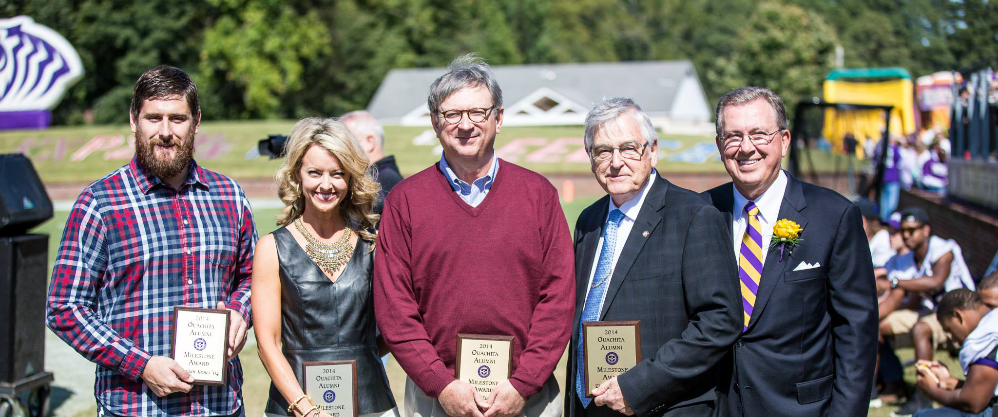 Ouachita Baptist University President Rex Horne (right) congratulates 2014 Alumni Milestone Award recipients (from left) Nathan James, Mica Strother, Richard Lusby and Dr. David Blase. Not pictured is Jamie Fowler.