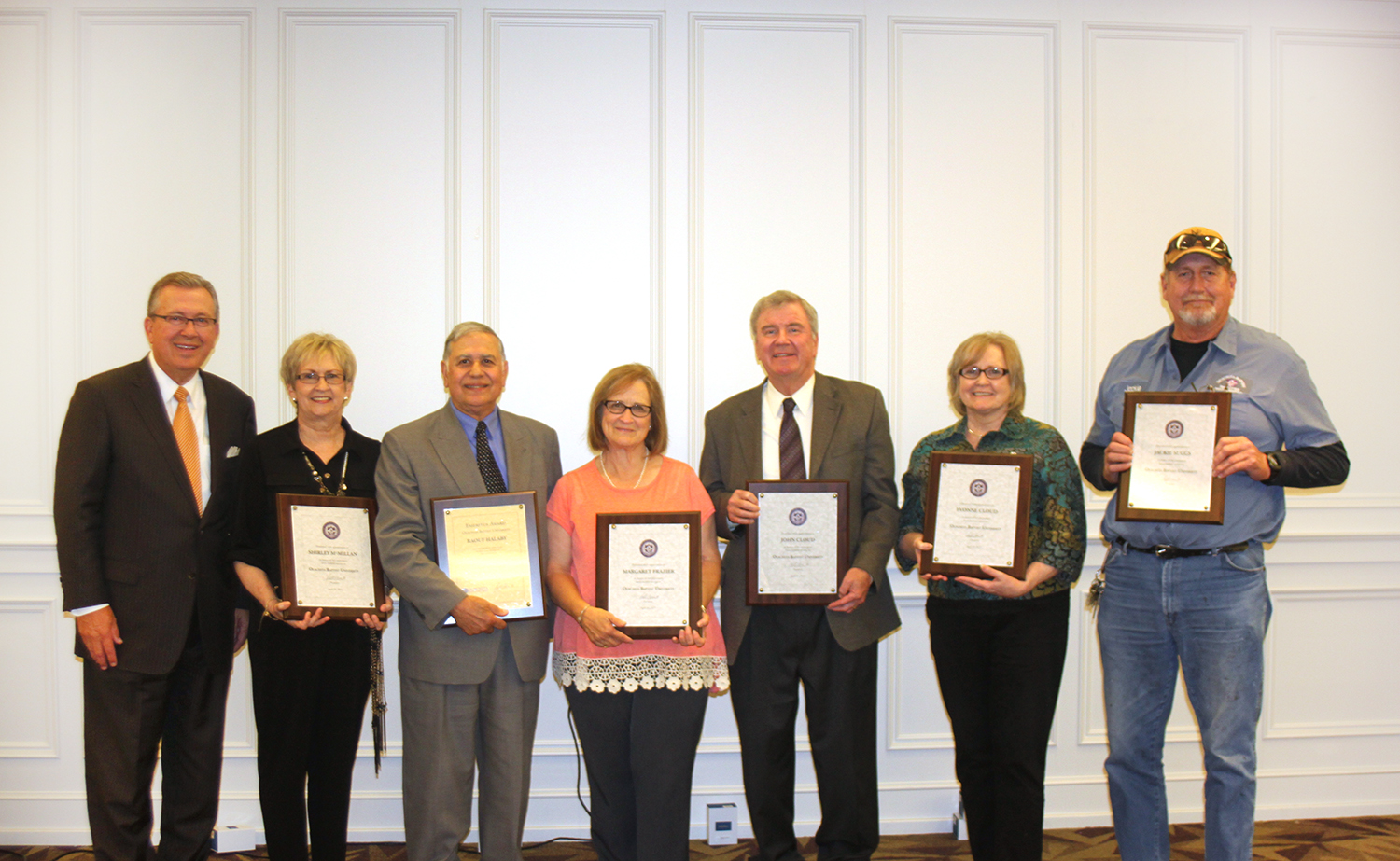 Ouachita President Rex Horne (at left) affirmed the work of six retirees, including (from left) Shirley McMillan, Dr. Raouf Halaby, Margaret Frazier, John Cloud, Yvonne Cloud and Jackie Suggs.