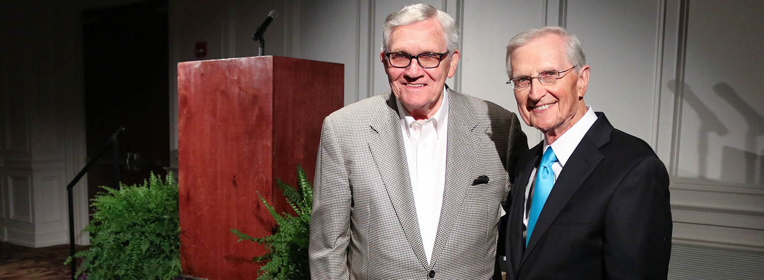 Dr. Ben M. Elrod, Ouachita chancellor, (at left) was honored for 40 years of service to the university by Dr. Charles Wright, interim president.