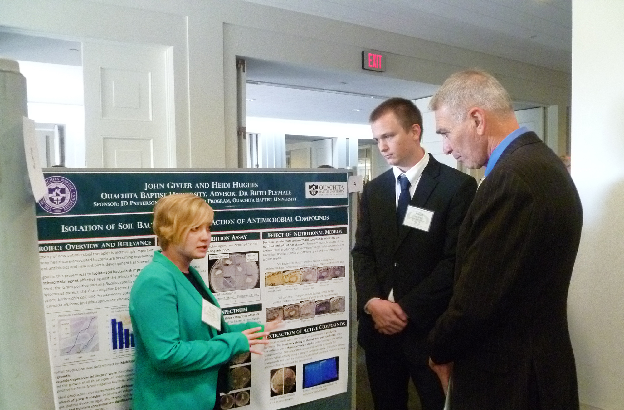 Rep. Ralph Abraham of Louisiana listens while Heidi Hughes and John Givler of Ouachita Baptist University present their research at the 20th annual Posters on the Hill event in Washington, D.C.