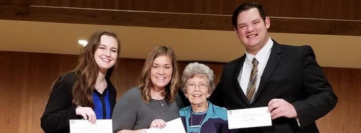 The 2017 McBeth Concerto Competition winners (from left), Morgan Taylor, Ashley Lovely and C.J. Slatton are congratulated by Mary McBeth (second from right).