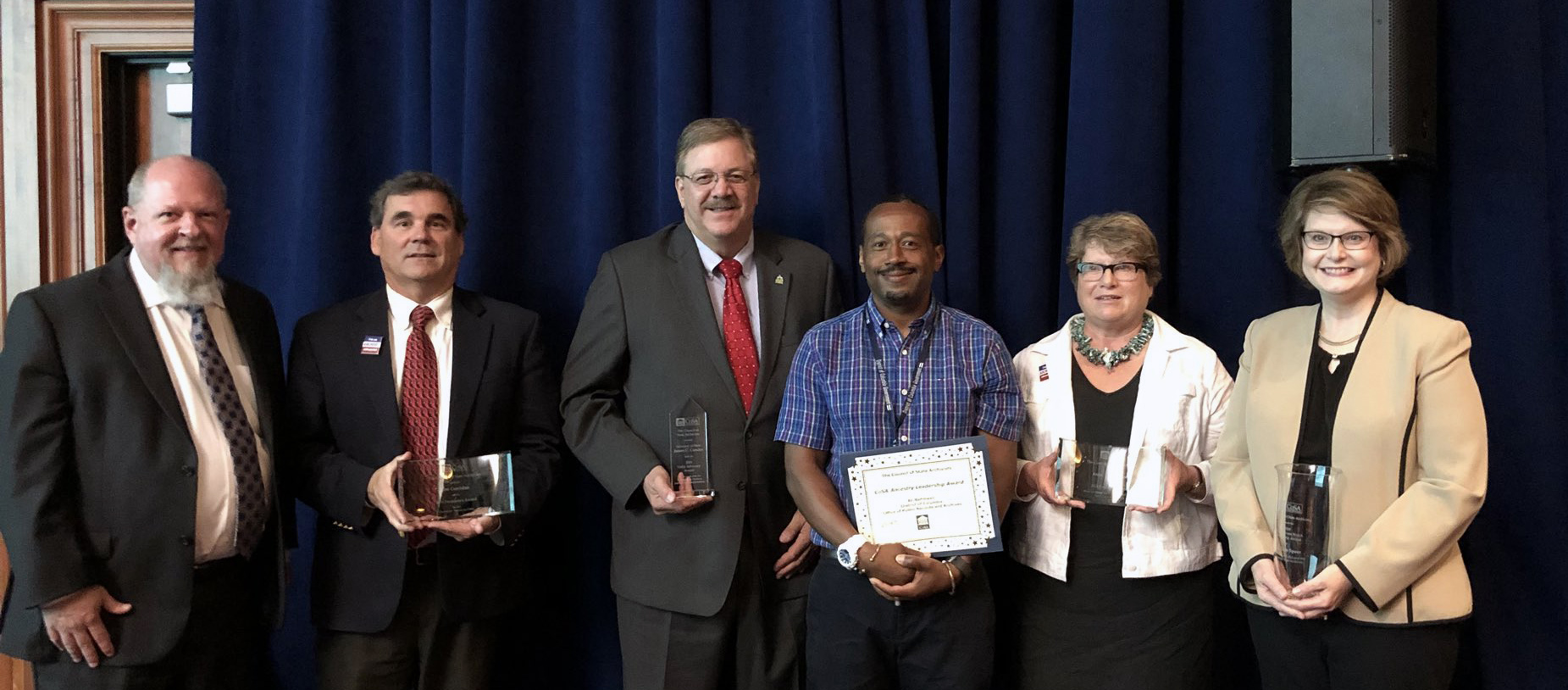 Dr. Lisa Speer (far right) recently received the Council of State Archivists’ Victoria Irons Walch Leadership Award. She is pictured here with other CoSA award winners, including: Tim Baker, CoSA president and Maryland state archivist; Jim Corridan, former Indiana state archivist; Vermont Secretary of State Jim Condos; Ali Rahmaan from the District of Columbia Office of Public Records; and Anne Ackerson, former CoSA executive director.