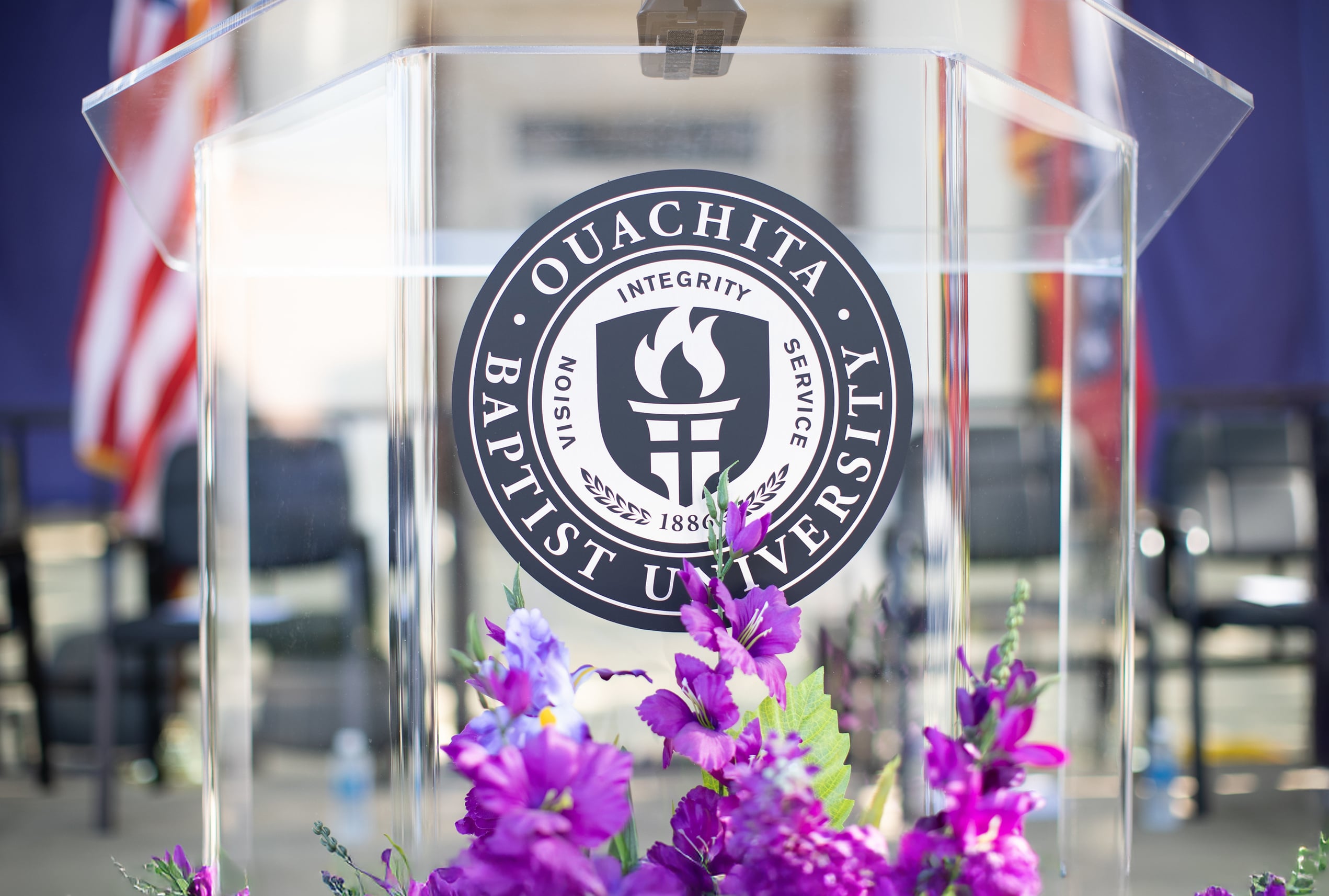 Ouachita podium surrounded by purple flowers