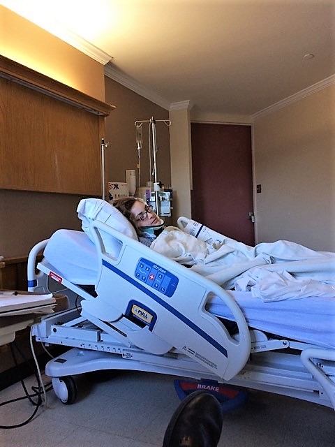 Laura in her hospital bed