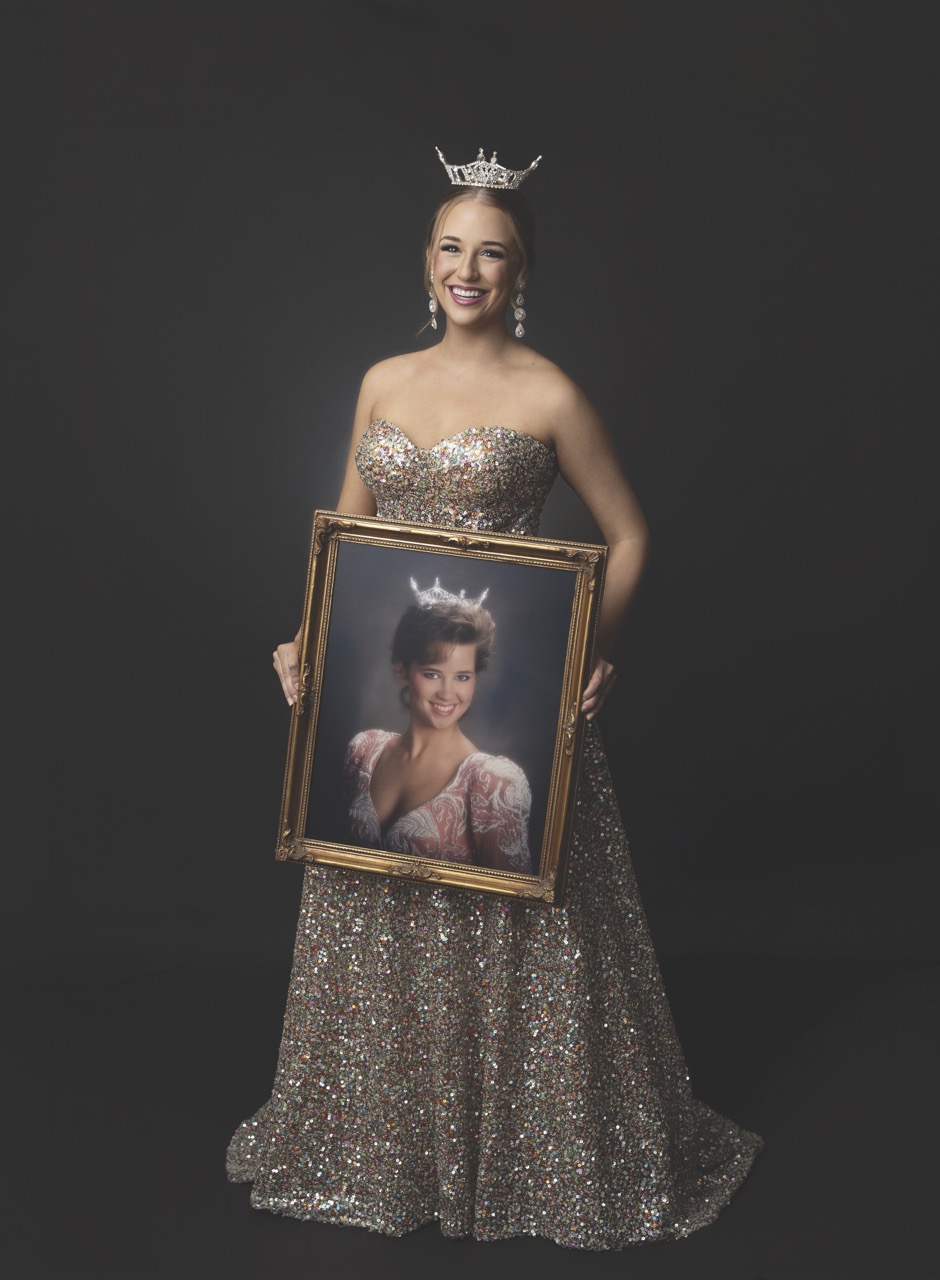 Ava Weeks with a portrait of mer mother as Miss OBU in 1992