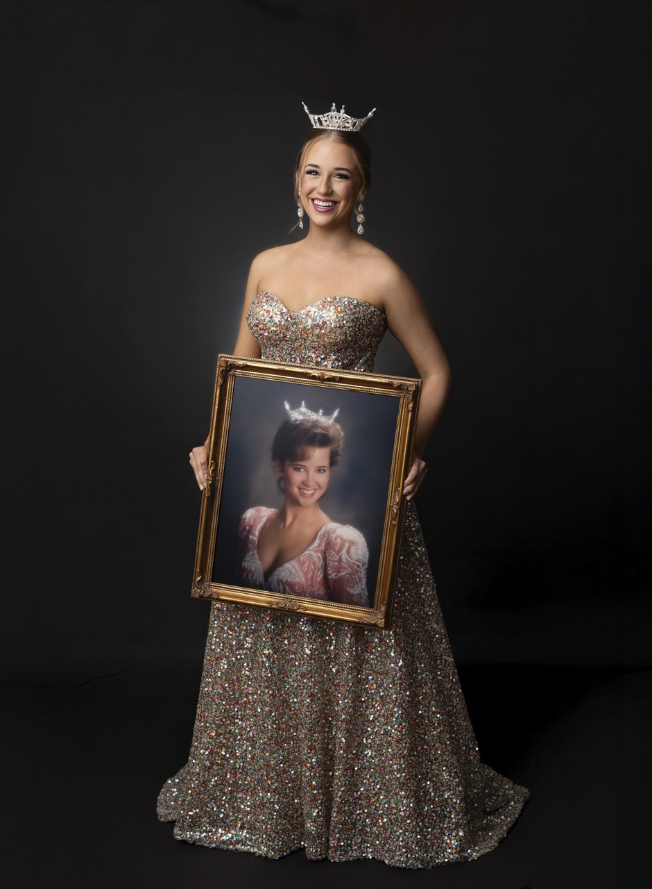 Ava Weeks with a portrait of mer mother as Miss OBU in 1992