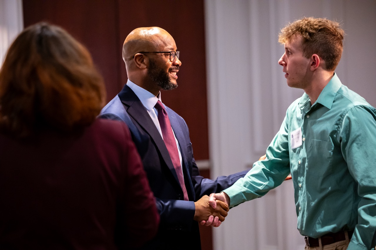 Students meet with Rice at the business luncheon