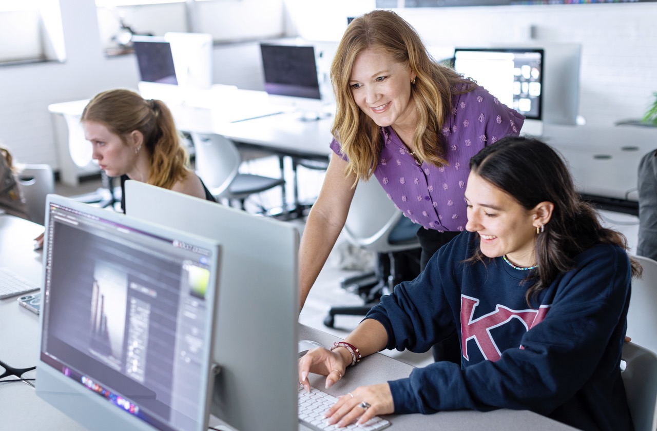 Ouachita instructor with graphic design students