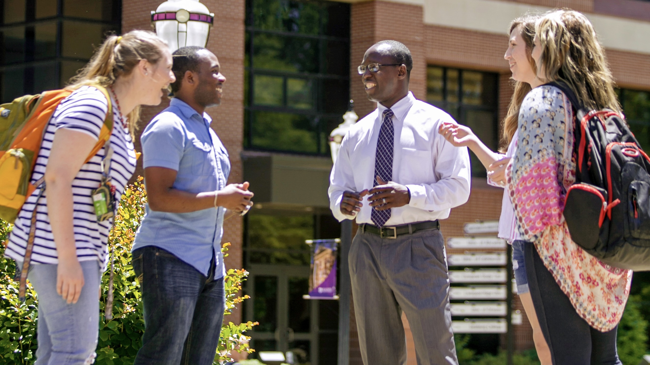 Dr. Rickey Rogers visits with students at Ouachita Baptist University