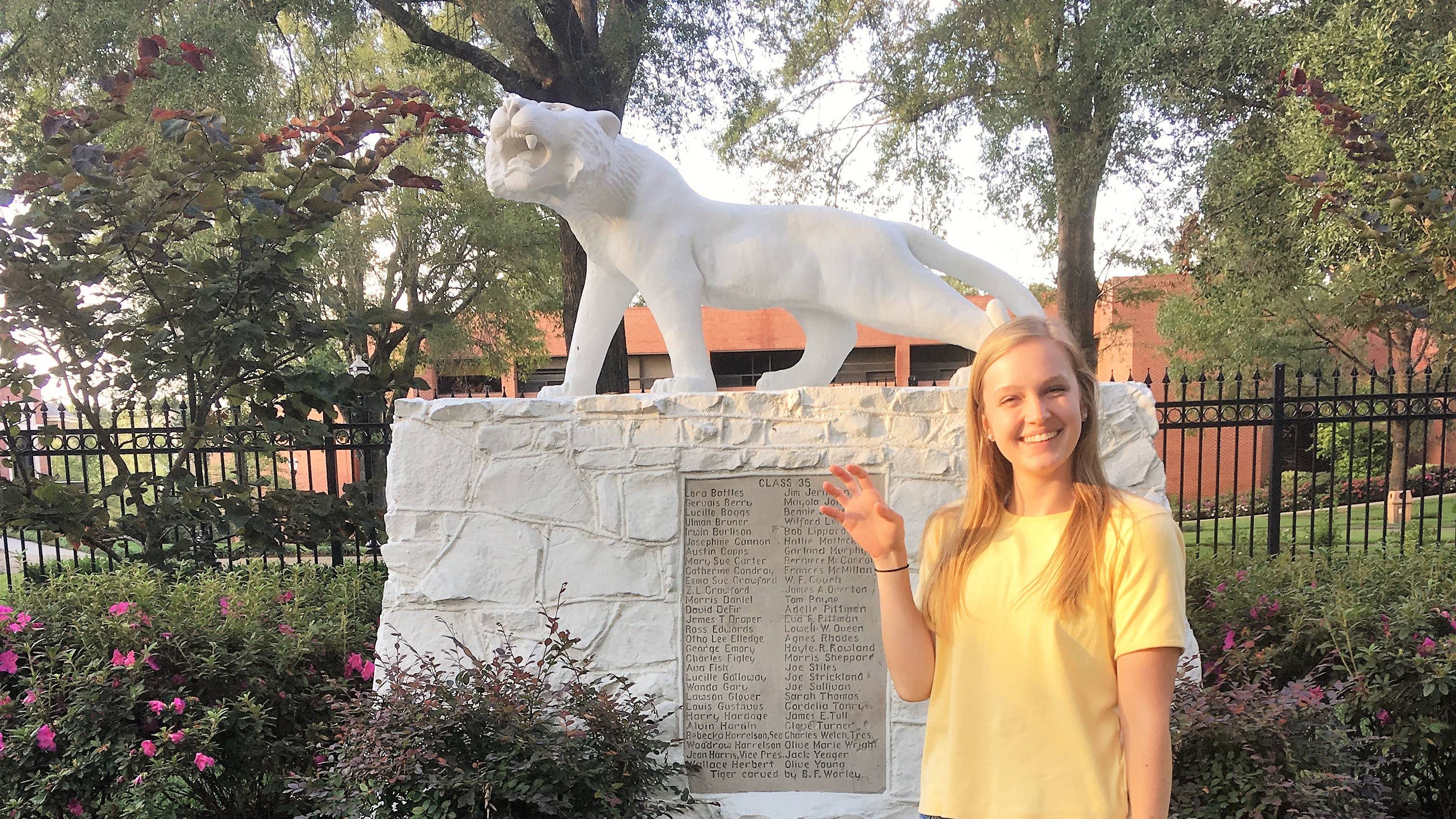 Shae poses with Ouachita's tiger statue