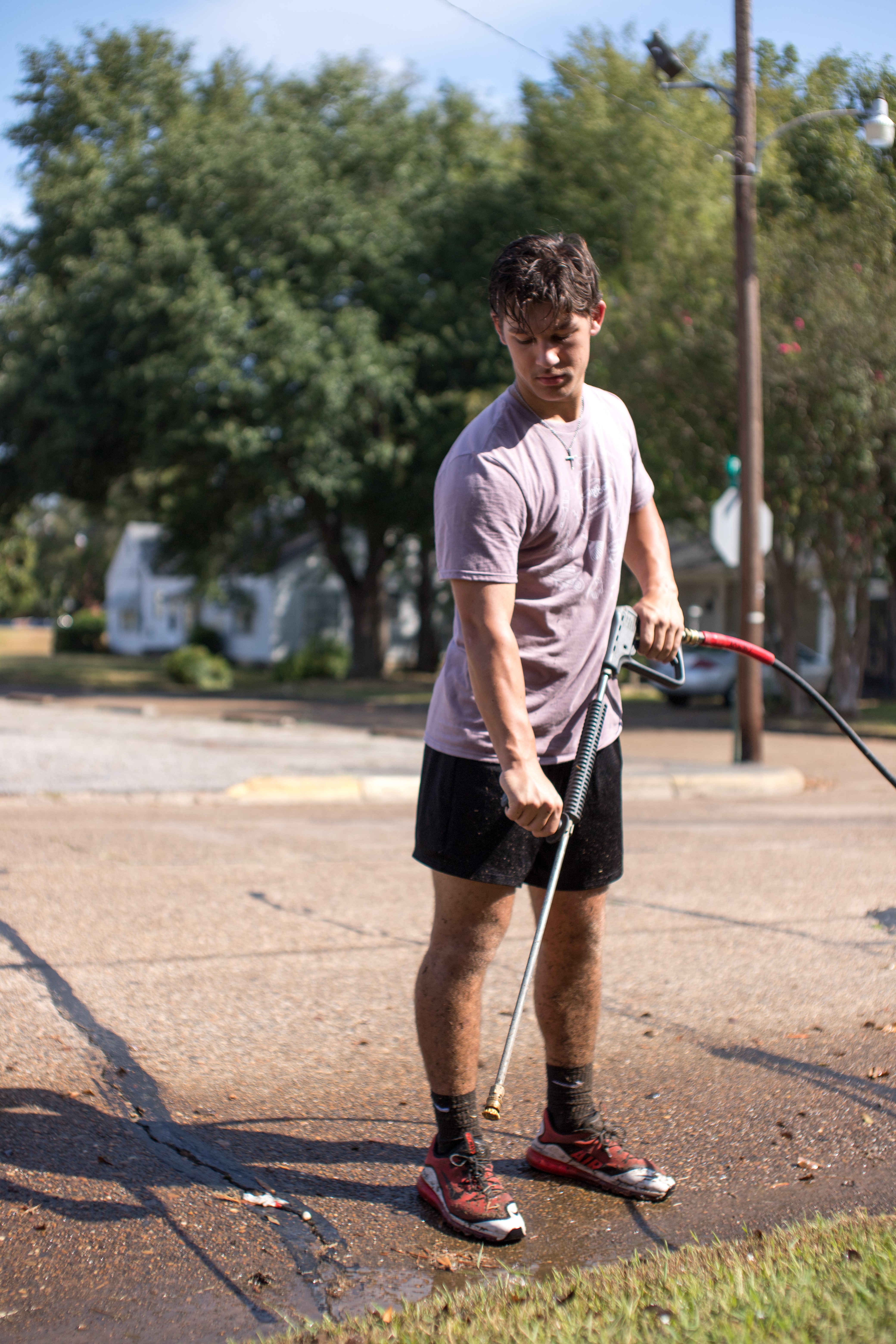 Tiger Serve Day student pressure washing